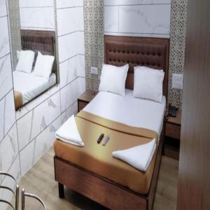 Postel nebo postele na pokoji v ubytování Hotel Royal Residency - Chembur