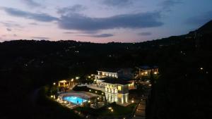 a large building with a swimming pool at night at Tenuta Santo Stefano Azienda Agrituristica in Santo Stefano del Sole