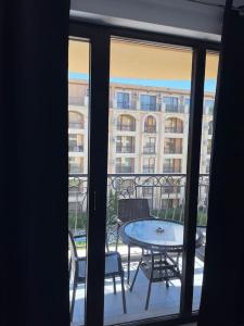 a view of a balcony with a table and chairs at k.k Elenite Vila Astoria 5 in Sveti Vlas