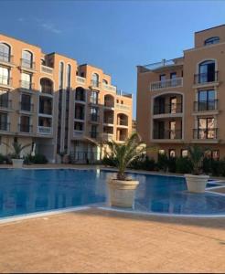 a swimming pool in front of some apartment buildings at k.k Elenite Vila Astoria 5 in Sveti Vlas