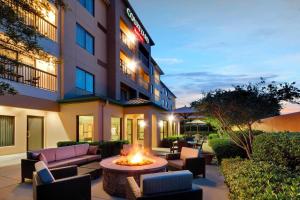 a hotel patio with a fire pit in front of a building at Courtyard Dallas Mesquite in Mesquite