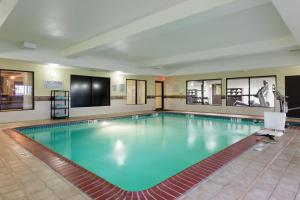 a large swimming pool in a hotel room at Courtyard Dallas Mesquite in Mesquite