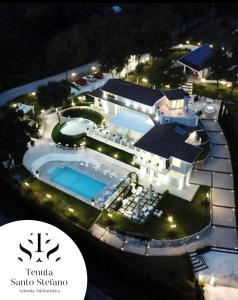an aerial view of a mansion with a swimming pool at Tenuta Santo Stefano Azienda Agrituristica in Santo Stefano del Sole
