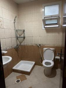 a bathroom with a toilet and a sink at Bed Space for Female single and bunk bed Al Sayed Builidng - Sharaf DG Exit 4 Flat 301 in Dubai