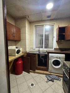 A kitchen or kitchenette at Bed Space for Female single and bunk bed Al Sayed Builidng - Sharaf DG Exit 4 Flat 301