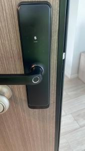 a close up of a door handle on a wooden door at Selena by the sea in Mamaia