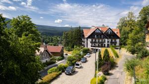 an aerial view of a town with cars parked in front of a building at Panorama Gór in Szklarska Poręba