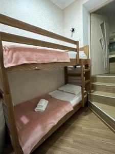 a couple of bunk beds in a room at Stumari Apartaments in Tbilisi City