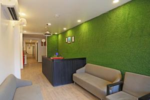 a waiting room with a green wall at Hotel Silver Velvet "Unmarried couple and local ID allowed" in New Delhi