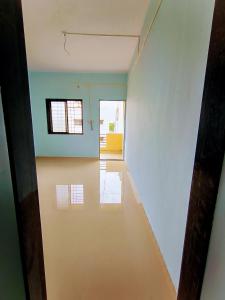 a hallway of a room with a white wall at Rathore Nivas in Pune
