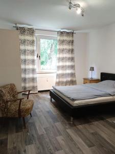 Postel nebo postele na pokoji v ubytování Wohnung am Waldrand