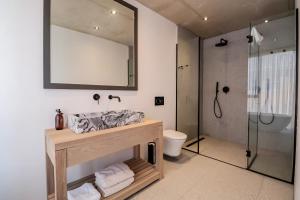 a bathroom with a sink and a shower at Mi Amor Myoli Beach in Sedgefield
