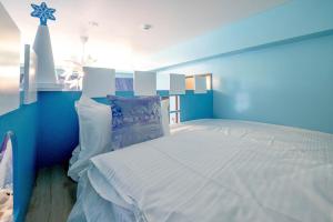Uma cama ou camas num quarto em Yilan 1955 B&B Second Branch