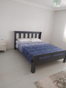 Postel nebo postele na pokoji v ubytování İNAN'S HOME
