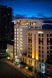a hotel building at night with a city at Courtyard by Marriott San Diego Gaslamp/Convention Center in San Diego
