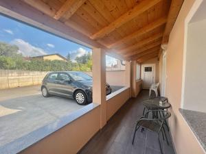 a balcony with a car parked in a garage at ZARA APARTMENTS in Koper