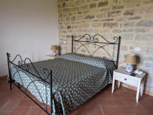 A bed or beds in a room at Agriturismo Torre Gialluise