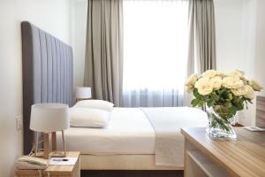 Cama ou camas em um quarto em Hotel Suisse