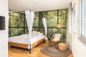 a bedroom with a bed and a window at LivingTown in Zürich