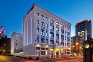 a large white building on a city street at night at Courtyard Columbus Downtown in Columbus