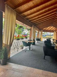 a lobby with couches and tables and a balcony at Hotel Intourist in Mukacheve