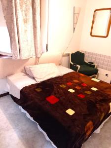 a bedroom with a bed with a brown blanket at Cozy!! Verona in Verona
