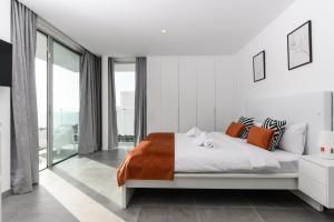 Postel nebo postele na pokoji v ubytování Villa Moada Ocean Breeze