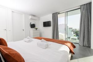 Postel nebo postele na pokoji v ubytování Villa Moada Ocean Breeze