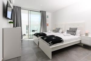 Postel nebo postele na pokoji v ubytování Villa Moada Ocean Breeze + 37 fotografií