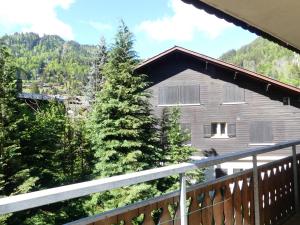 a view from the balcony of a house at GENTIANES 2 - Appartement centre village et proche pistes de ski - Wifi in La Clusaz