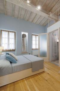 Postel nebo postele na pokoji v ubytování Casa Bel Tramonto con giardino privato a Cortona