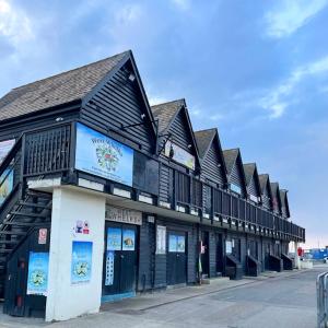 a black and white building on a street at The Bubble Hideaway - A Little Oasis near the Sea in Whitstable