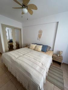 a bedroom with a bed and a ceiling fan at Apartamento Soña Club Tenerife Los Cristianos in Los Cristianos +43 photos