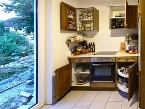 a kitchen with a sink and a stove at Jurte in Bayern – spirituelle Reise ins Keltenland in Neuburg an der Donau