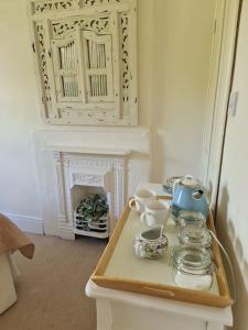 a room with a table with a tea set on it at Home from home in Linton in Linton