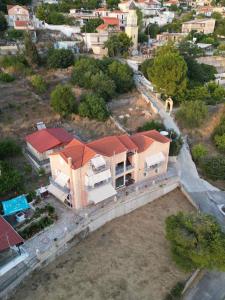 an aerial view of a house with an orange roof at Victoria's Apartments in Dilin&aacute;ta