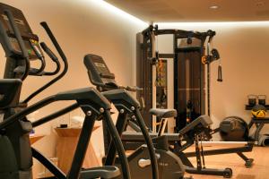 a gym with several exercise bikes in a room at Les Regalia Hôtel & Spa in Sainte-Lucie de Porto-Vecchio