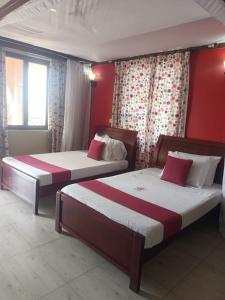Postel nebo postele na pokoji v ubytování Lambada Holiday Resort Mombasa + 33 fotografií