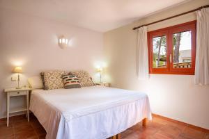 Postel nebo postele na pokoji v ubytování Can Jon