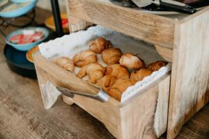 a box filled with lots of croissants on a table at Mas Gallau in Cambrils