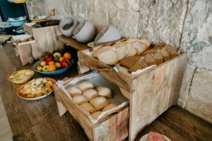 a bunch of breads and other foods on a table at Mas Gallau in Cambrils