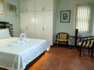 Postel nebo postele na pokoji v ubytování DMC2 Residence Panglao