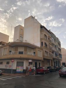 a tall building with people standing in front of it at NABILA9 in Torrevieja