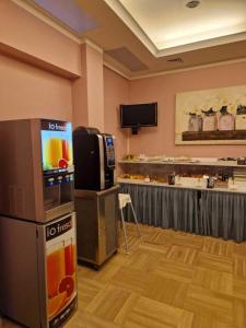 TV a/nebo společenská místnost v ubytování Hotel Dogana