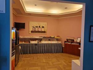 TV a/nebo společenská místnost v ubytování Hotel Dogana