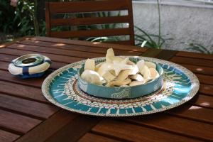 a bowl of shells on a plate on a table at Blue B&B in Formia
