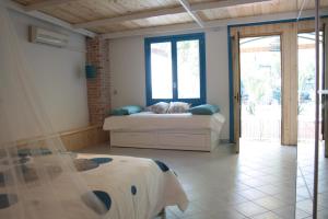 a bedroom with a bed and a window at Blue B&B in Formia