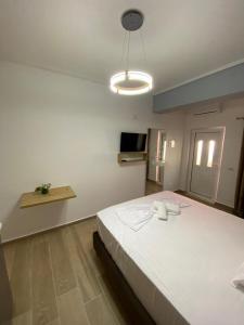 Postel nebo postele na pokoji v ubytování RIAN GUEST HOUSE