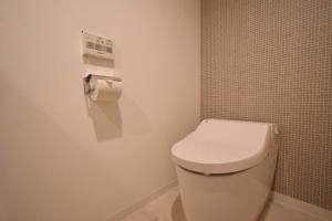 a bathroom with a white toilet in a room at 東駒形302 in Tokyo