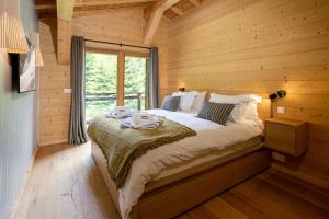 En eller flere senge i et værelse på Chalet Bonnabelle - Chamonix All Year